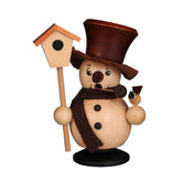 Charming wooden snowman holding a birdhouse, adding a festive touch to winter decor.